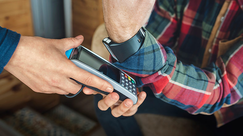 person uses digital watch to make eftpos payment