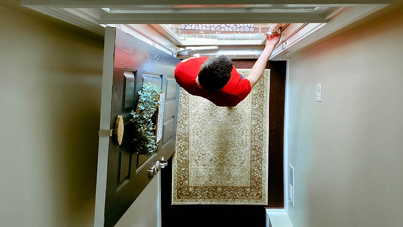 A home buyer opens the front door of his new home.