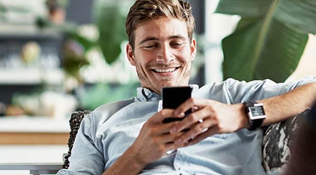 Guy using his mobile phone
