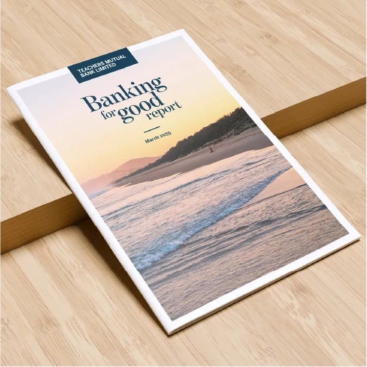 A report titled "Banking for good report" from TMBL displayed on a light wooden surface.