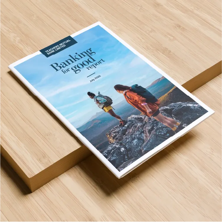 A report titled "Banking for good report" from TMBL displayed on a light wooden surface.